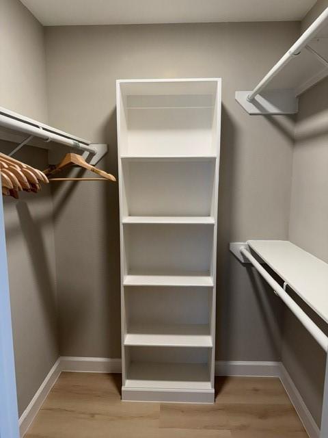 walk in closet featuring light wood-type flooring