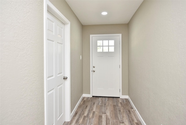 doorway to outside with light hardwood / wood-style flooring