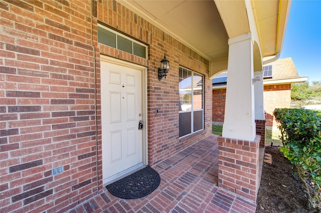 doorway to property with covered porch