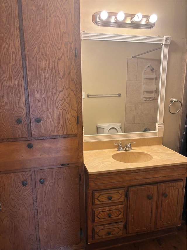 bathroom with vanity and toilet