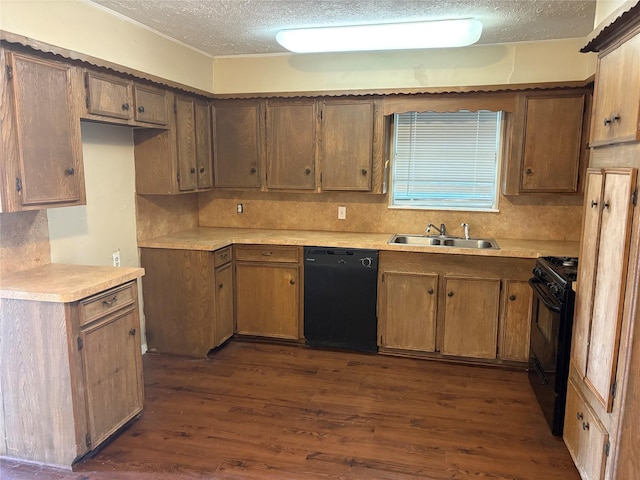 kitchen with black appliances, sink, dark hardwood / wood-style floors, decorative backsplash, and a textured ceiling