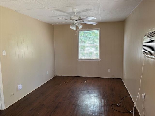 spare room with ceiling fan and dark hardwood / wood-style floors