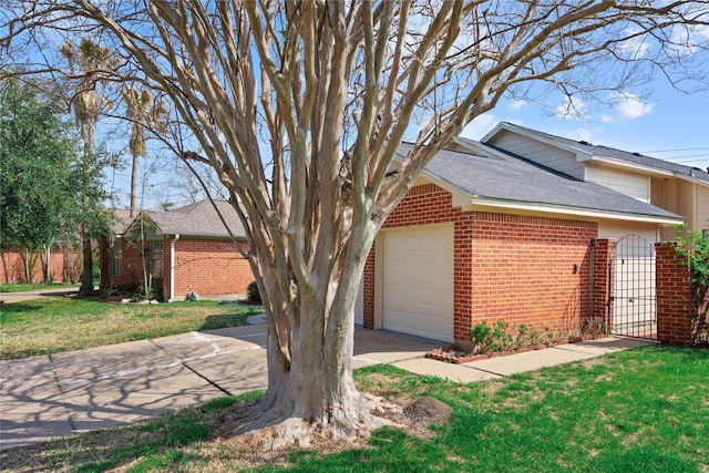 view of side of property with a garage and a yard