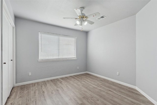 unfurnished room with light hardwood / wood-style floors and ceiling fan