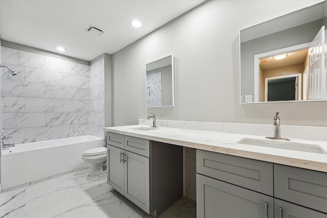 full bathroom with bathtub / shower combination, vanity, and toilet