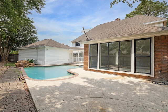 view of swimming pool featuring a patio area