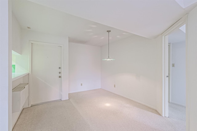 spare room with light colored carpet