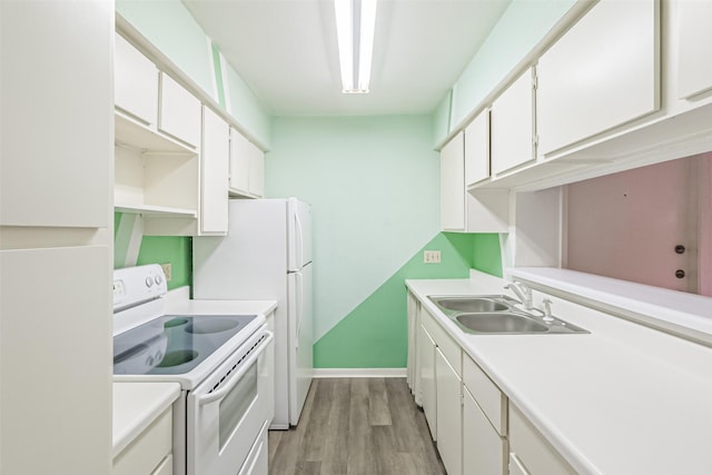 kitchen featuring white cabinets, light hardwood / wood-style flooring, white electric stove, and sink