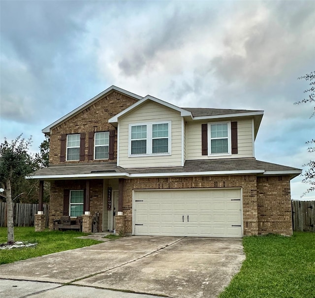 view of front of house featuring a front yard and a garage