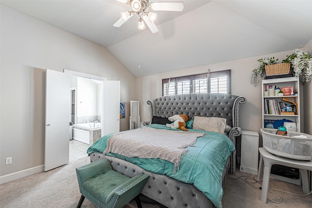 bedroom with ceiling fan, light carpet, connected bathroom, and vaulted ceiling