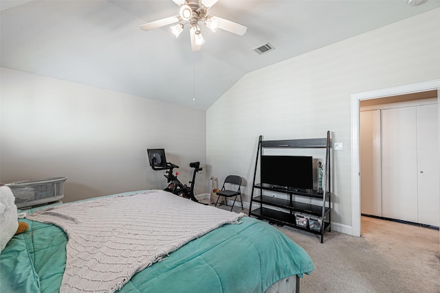 carpeted bedroom with ceiling fan and lofted ceiling