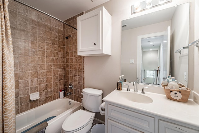 full bathroom featuring shower / tub combo, vanity, and toilet