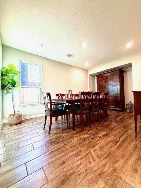 dining room with a textured ceiling