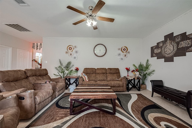 living room featuring ceiling fan and light tile patterned floors