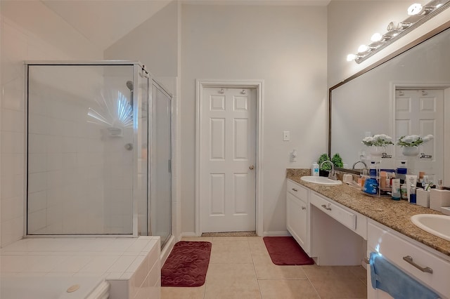 bathroom featuring tile patterned flooring, lofted ceiling, a shower with shower door, and vanity