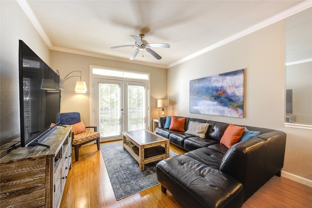 living room featuring ceiling fan, french doors, wood-type flooring, and ornamental molding