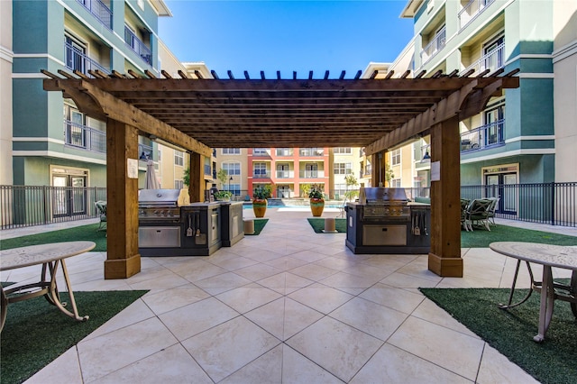 view of patio featuring area for grilling, a pergola, and a community pool