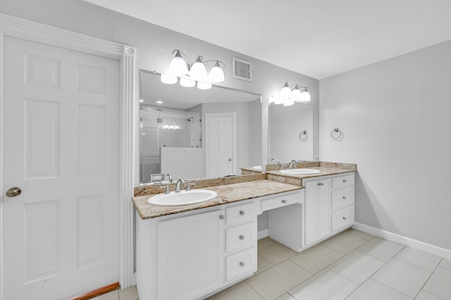 bathroom featuring tile patterned flooring, vanity, and an enclosed shower