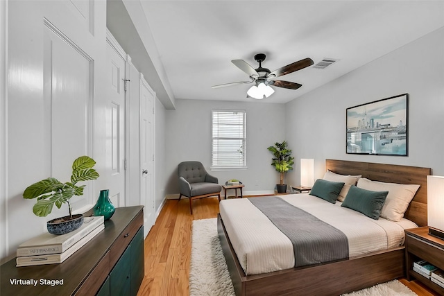 bedroom with ceiling fan and light wood-type flooring