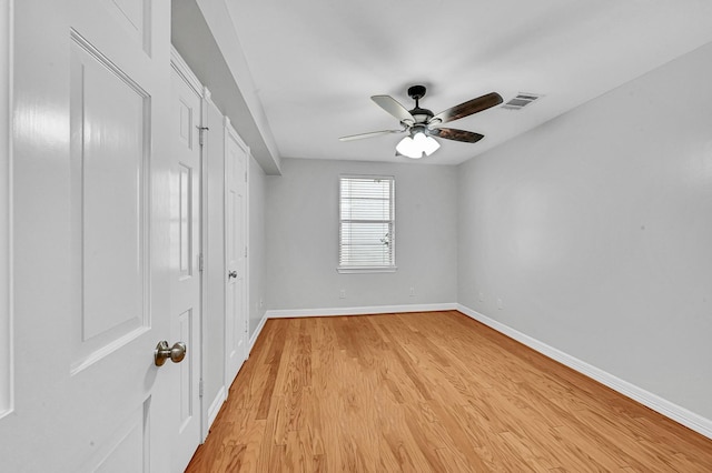 unfurnished room featuring ceiling fan and light hardwood / wood-style flooring