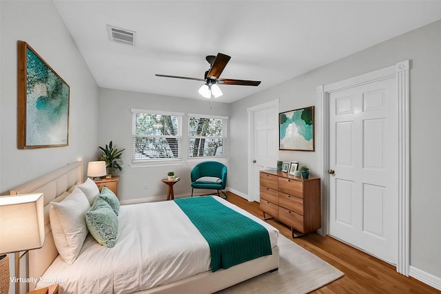 bedroom featuring ceiling fan and hardwood / wood-style flooring