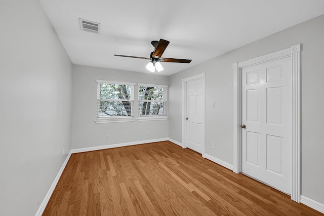 unfurnished bedroom featuring ceiling fan and light wood-type flooring