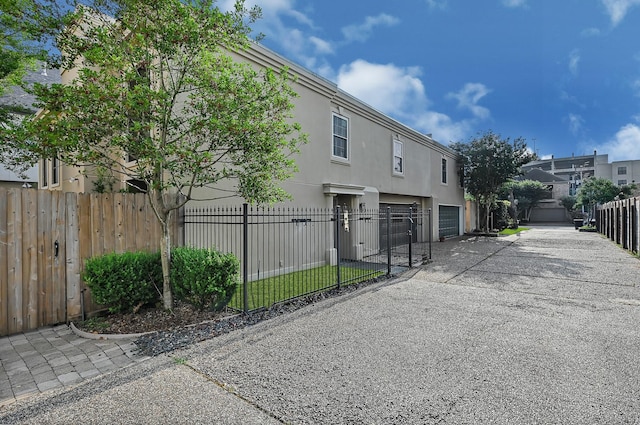 view of side of property with a garage