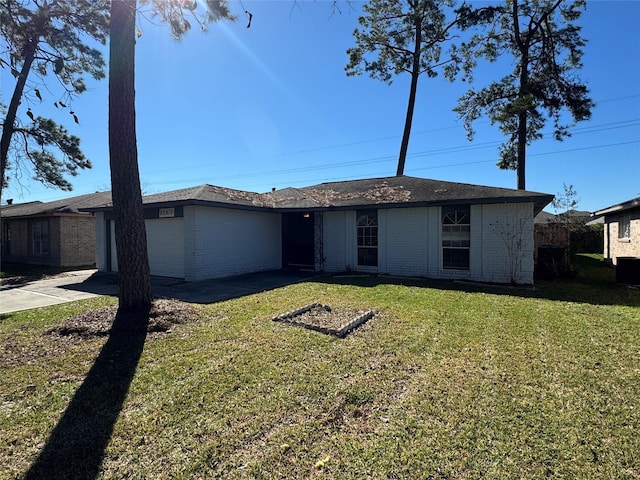 single story home with a front lawn and a garage