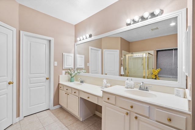 bathroom featuring tile patterned floors, vanity, and an enclosed shower