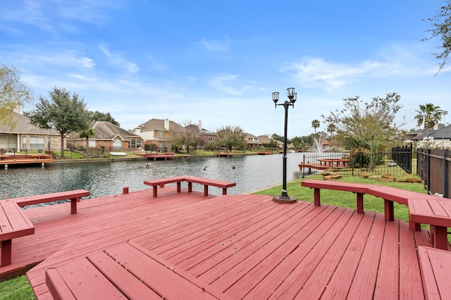 view of dock with a deck with water view