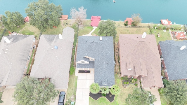 birds eye view of property featuring a water view