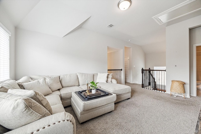 living room with carpet and vaulted ceiling