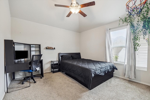 bedroom featuring ceiling fan, light colored carpet, and vaulted ceiling