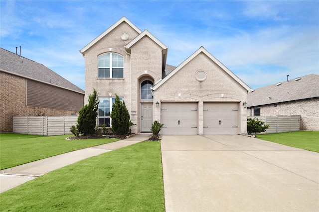 view of front of home with a front yard and a garage