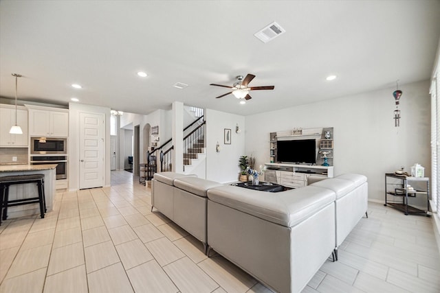 living room with ceiling fan