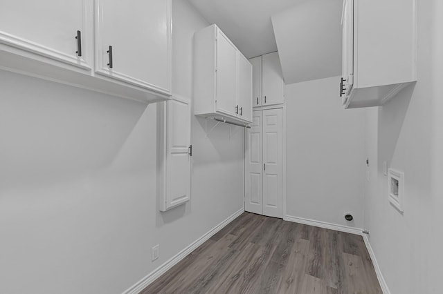 laundry area with cabinets, wood-type flooring, hookup for a washing machine, and hookup for an electric dryer