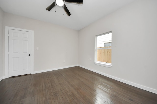 empty room with dark wood-type flooring and ceiling fan