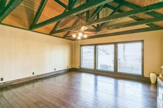 empty room featuring hardwood / wood-style floors, vaulted ceiling with beams, and ceiling fan