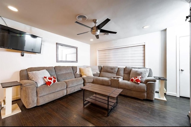 living room with dark hardwood / wood-style floors and ceiling fan