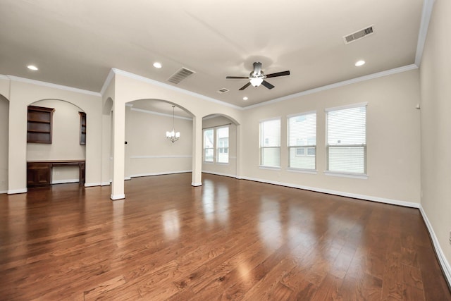 unfurnished living room featuring ceiling fan with notable chandelier, dark hardwood / wood-style flooring, and crown molding