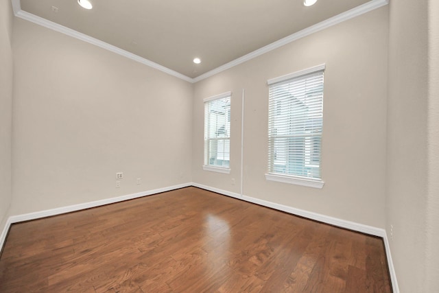 unfurnished room featuring hardwood / wood-style floors and ornamental molding