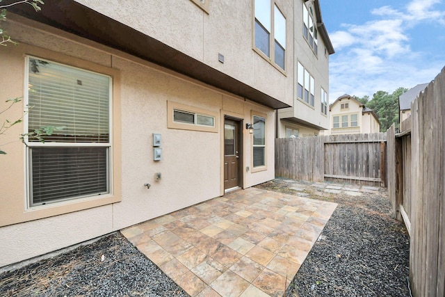 doorway to property with a patio area