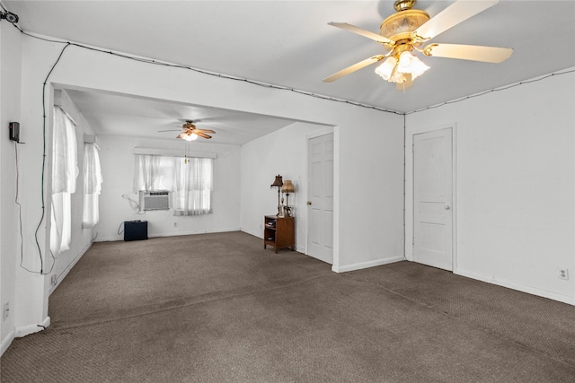 carpeted spare room featuring ceiling fan and cooling unit