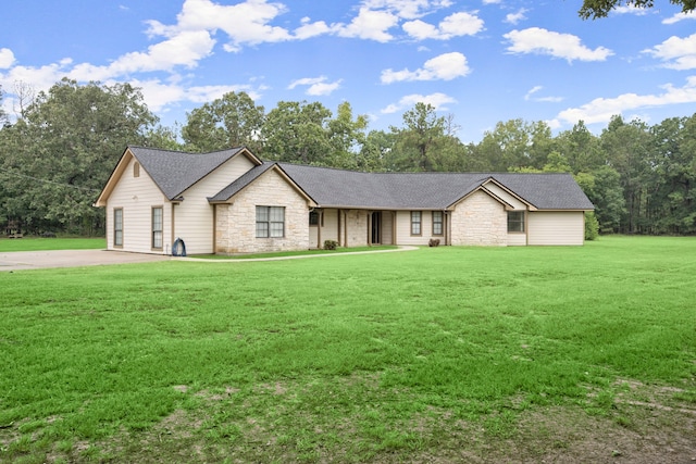 ranch-style home featuring a front yard