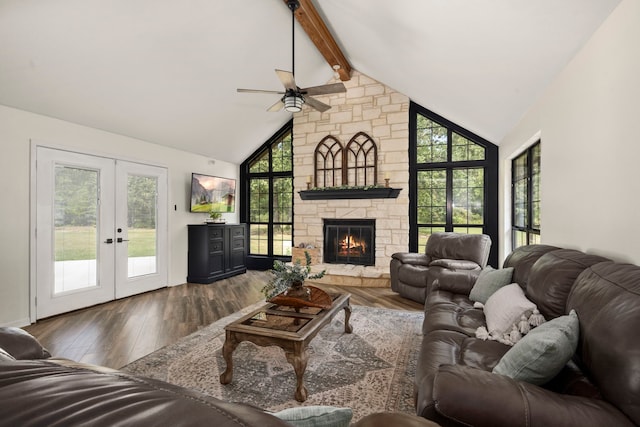 living room featuring lofted ceiling with beams, ceiling fan, a healthy amount of sunlight, and french doors