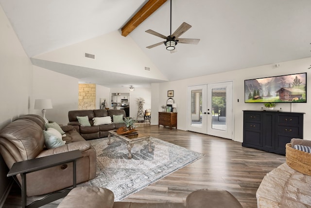 living room with french doors, ceiling fan, beam ceiling, high vaulted ceiling, and dark hardwood / wood-style floors