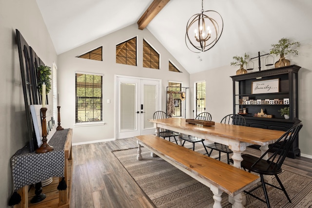 dining room with a chandelier, dark hardwood / wood-style flooring, a healthy amount of sunlight, and french doors