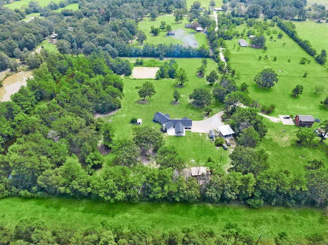 birds eye view of property with a water view and a rural view