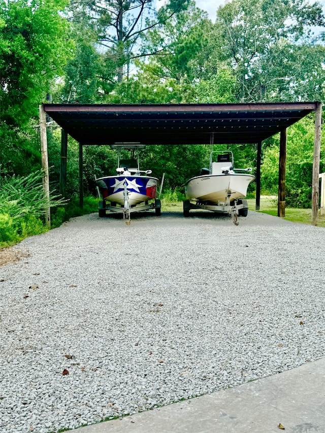 view of vehicle parking with a carport