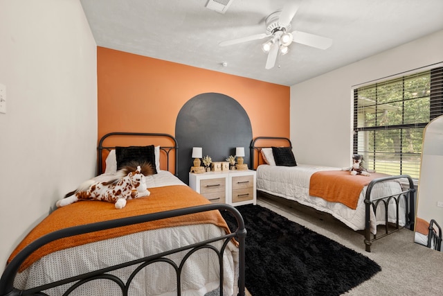 carpeted bedroom with ceiling fan